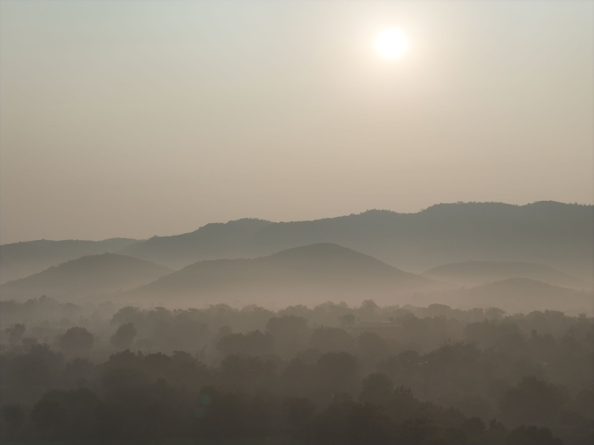 Layered misty mountains from a drone