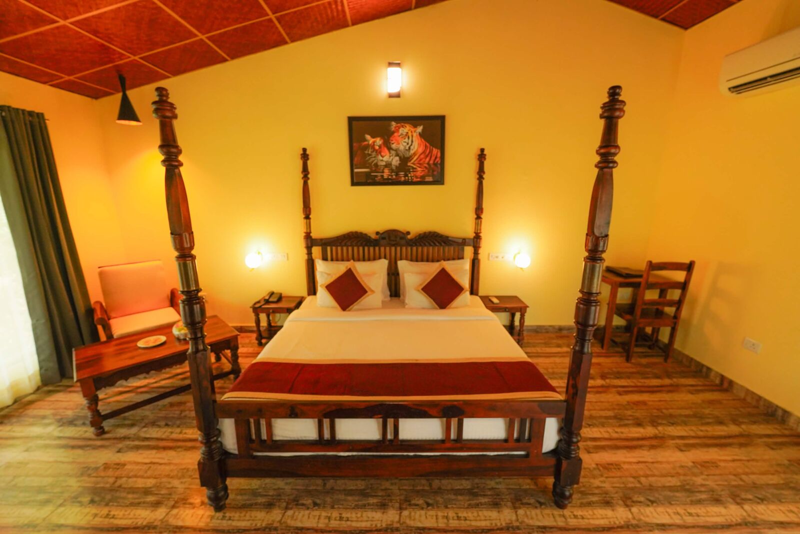 Front view of a four-poster bed in a resort room