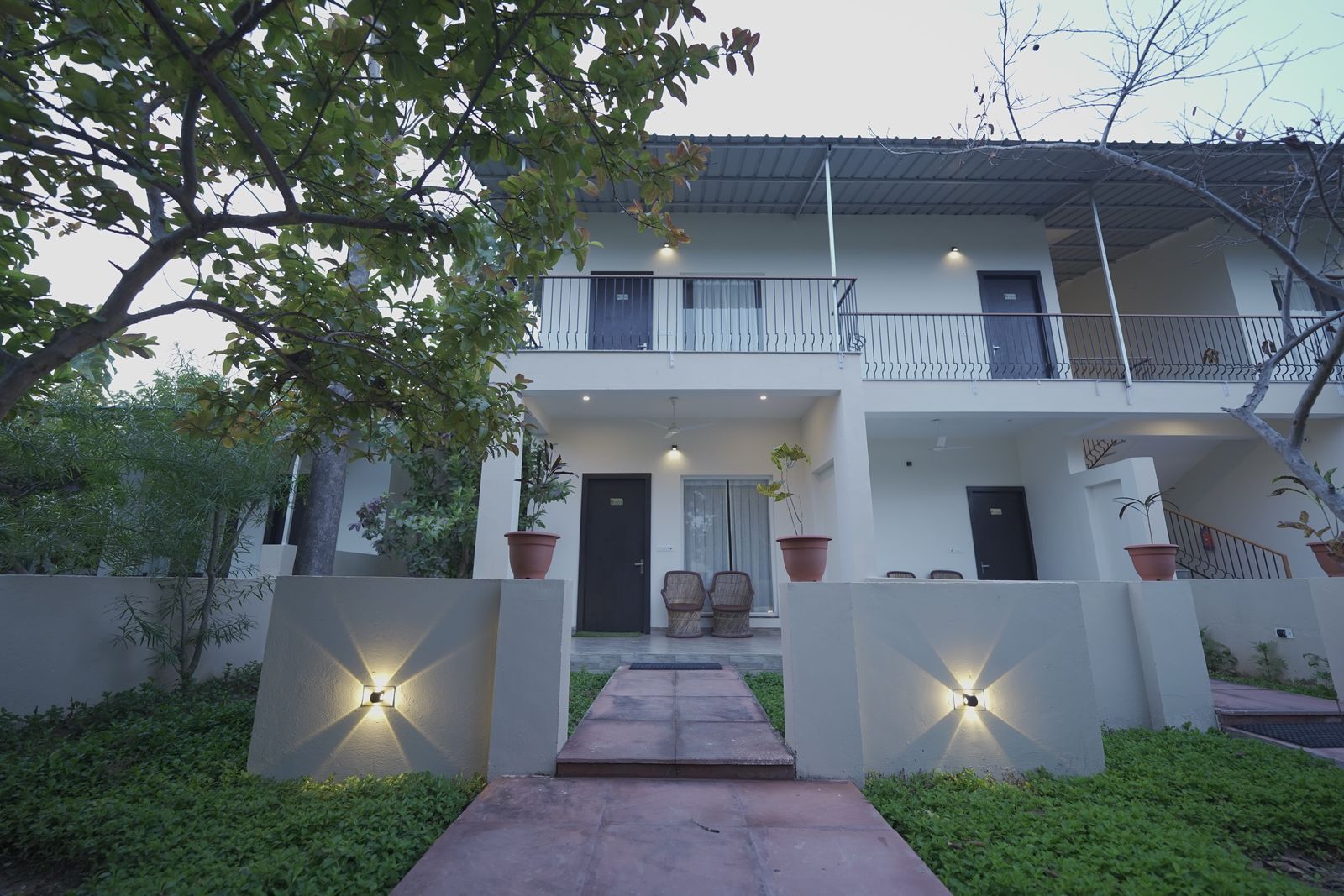 White villa exterior at dusk